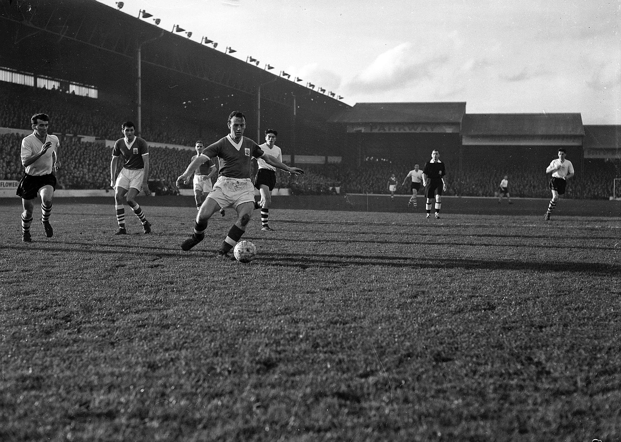 City`s Trevor Smith attempts a back pass with Jimmy Adam in pursuit