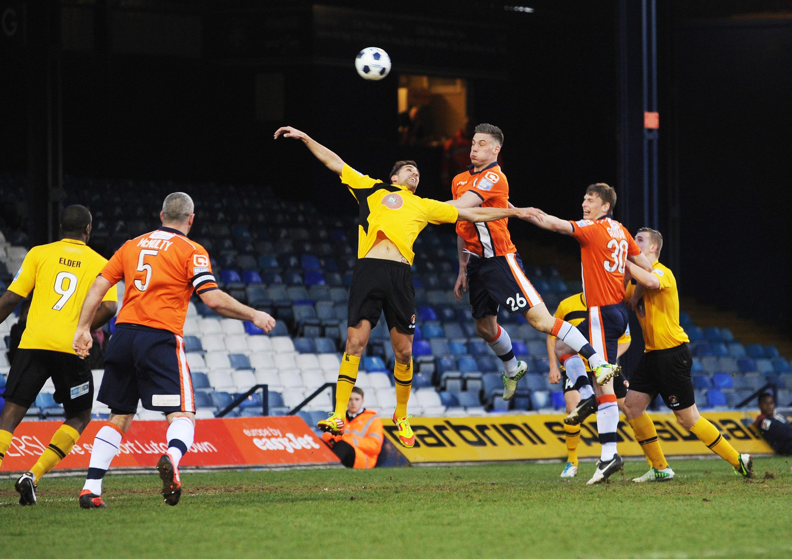 Alex Wall rises highest to win a header