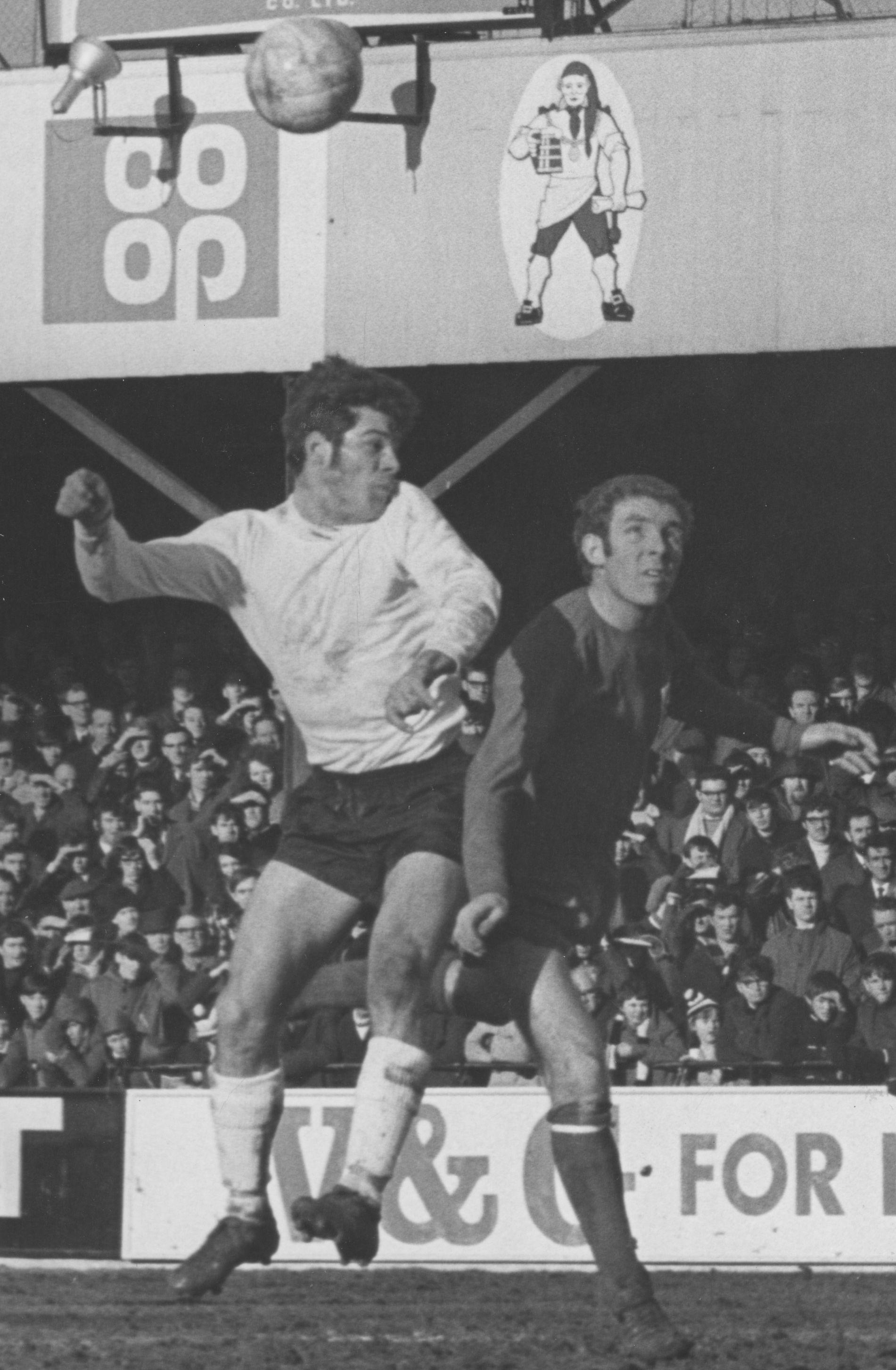 Malcolm Macdonald first to the ball